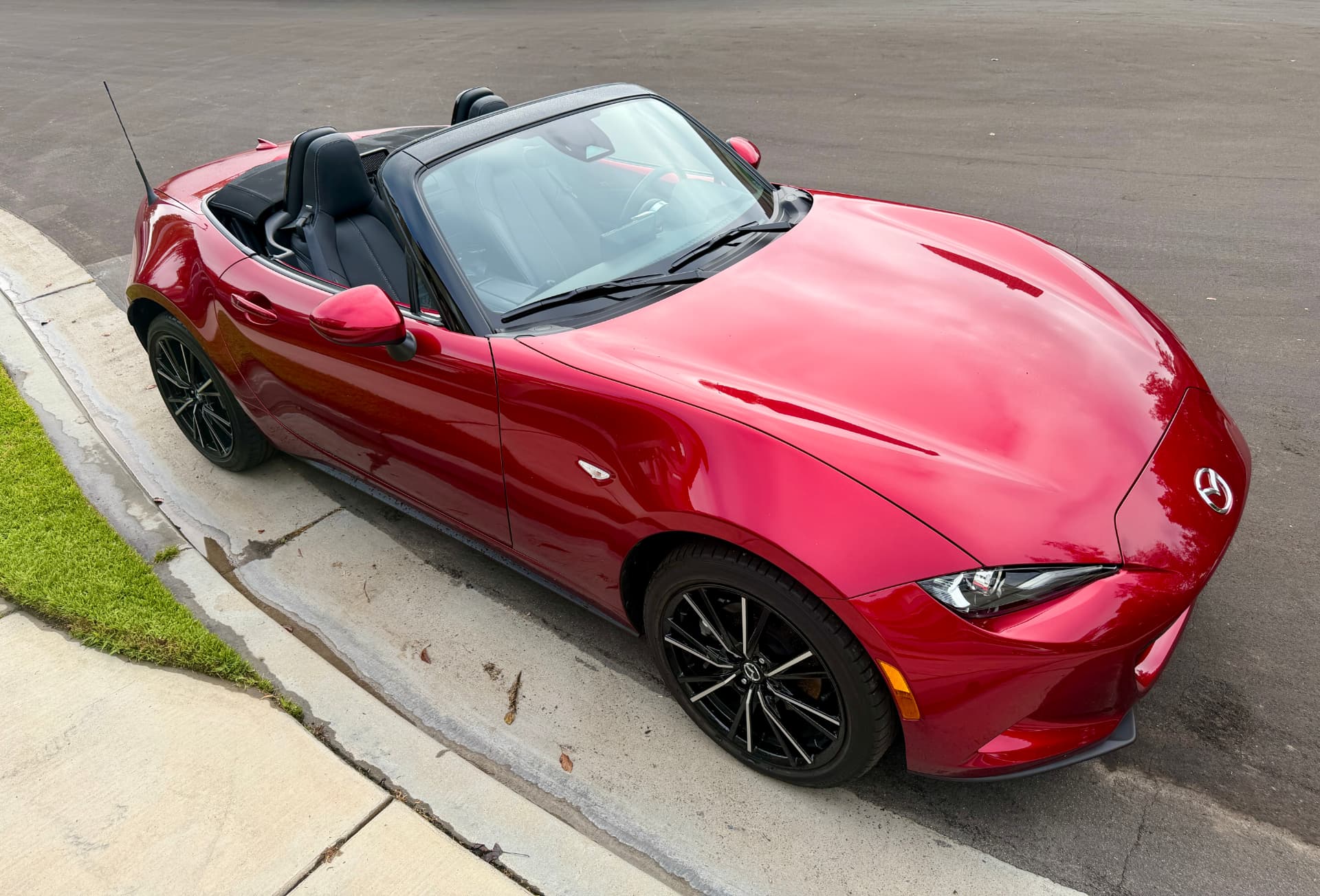 Red Mazda Miata photographed from above with its top down